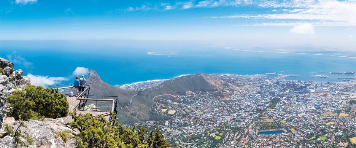 Tourists at a viewpoint on Table Mountain overlooking the city of Cape Town, South Africa