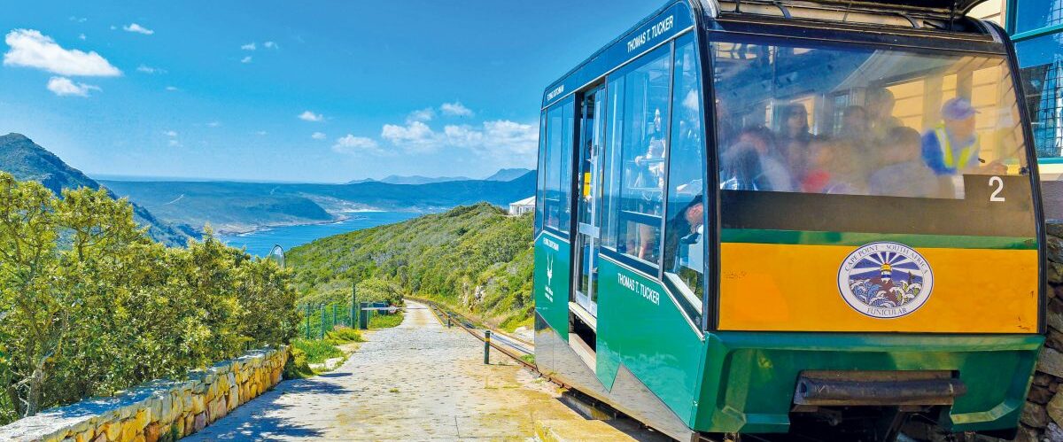 The Funicular moving the passengers to the top of the Cape Point with the Cape of Good Hope at the background, Cape Town, South Africa