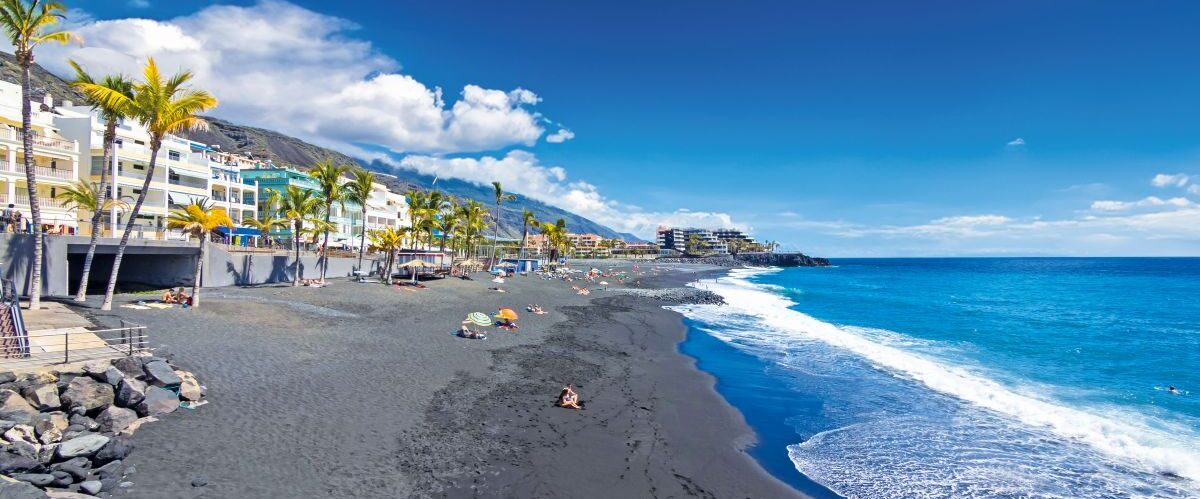 Spain, Balearic Islands, Puerto Naos, Tourists on the black lava beach