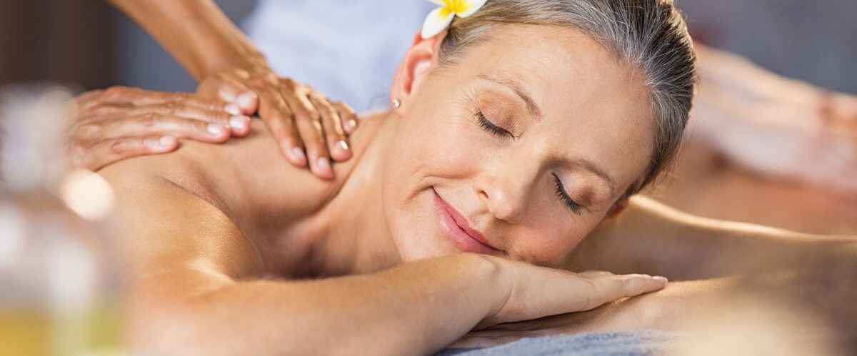 Woman receiving massage at spa