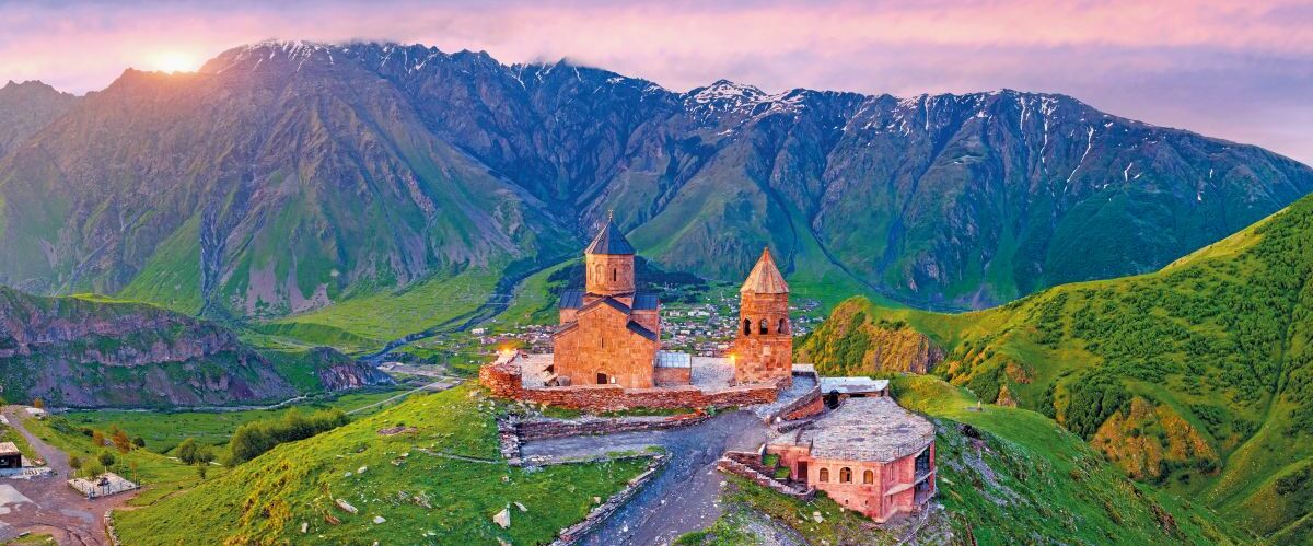 Aerial view of Gergeti trinity church at sunrise in Georgia.